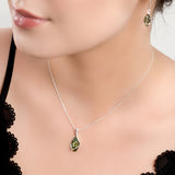 Elegant Twist Necklace in Silver and Green Amber