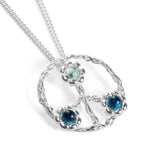Symbol of Peace Necklace in Silver and Blue Topaz