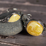 Artisan-Crafted Statement Bracelet in Silver with Milky Baltic Amber