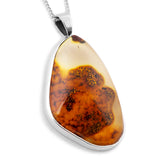Earth’s Edge: Raw Baltic Amber in Natural Form with Raw Bark Back