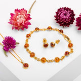 Round Charm Necklace in Silver with 24ct Gold & Cognac Amber