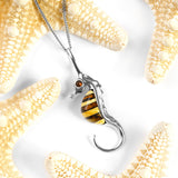 Tiny Seahorse Necklace in Silver and Amber