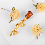 Single Stem Rose Brooch in Silver with 24ct Gold & Cognac Amber