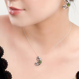 Climbing Chameleon Necklace in Silver and Green Amber