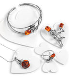 Double Rose Brooch in Silver and Cognac Amber