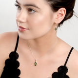 Elegant Twist Necklace in Silver and Green Amber