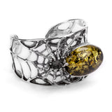 Captivating Spider Bangle in Silver and Green Amber
