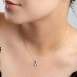 Round Charm Necklace in Silver and Blue Topaz