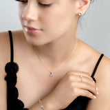 Small Round Stud Earrings in Silver and Blue Topaz