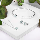 Small Round Stud Earrings in Silver and Blue Topaz