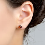 Small Round Stud Earrings in Silver and Cognac Amber