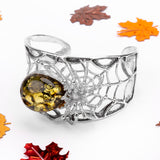 Captivating Spider Bangle in Silver and Green Amber